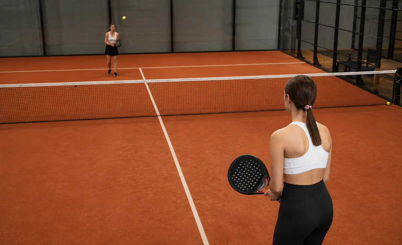 Two players during a padel match